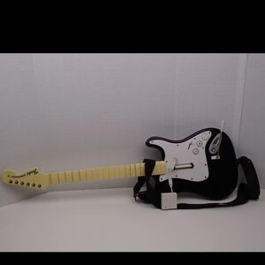 Rock Band Wii Guitar with Dongle included. Tested